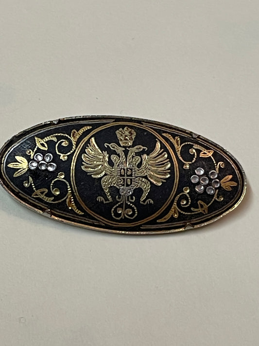 Broche ovale vintage des années 1950  Damascène noir et or et argent 4,5cm